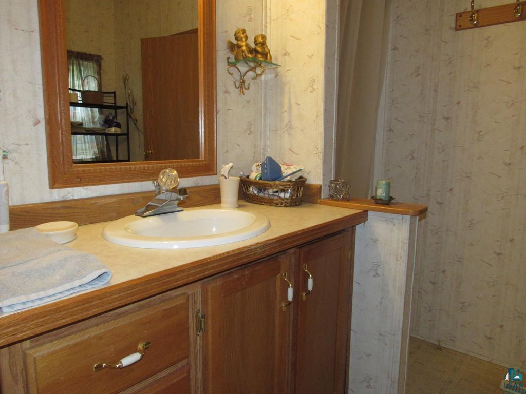 5243 East Neuman Road Superior, WI 54880 - Photo 27 of 35 Bathroom featuring tile flooring and vanity