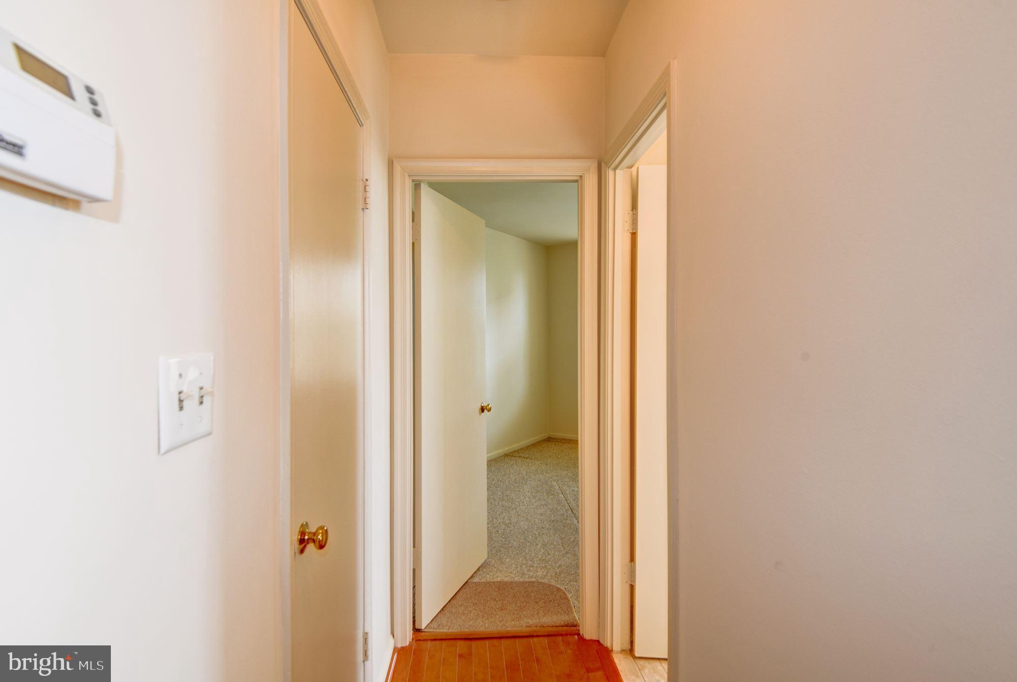 2001 16th Street Northwest, Unit 404 Washington, DC 20009 - Photo 15 of 35 Hallway with hardwood floors to bedroom