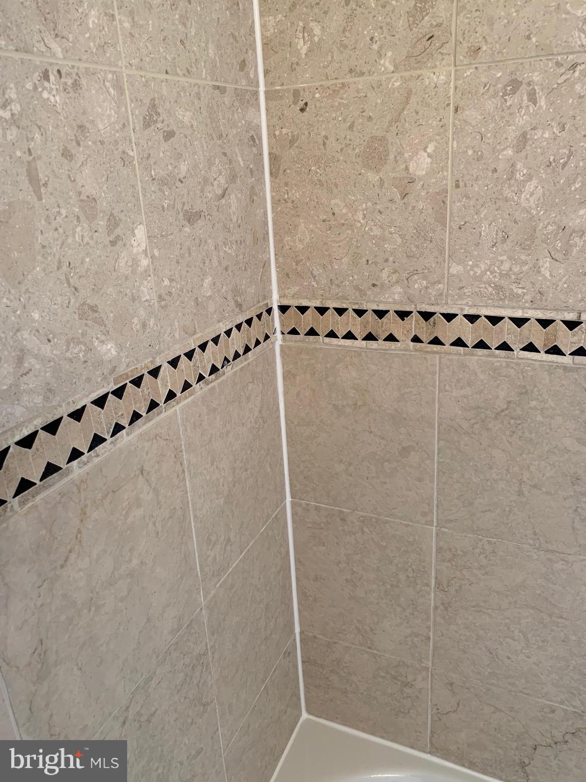 2001 16th Street Northwest, Unit 404 Washington, DC 20009 - Photo 19 of 35 Ceramic tiles line the tub