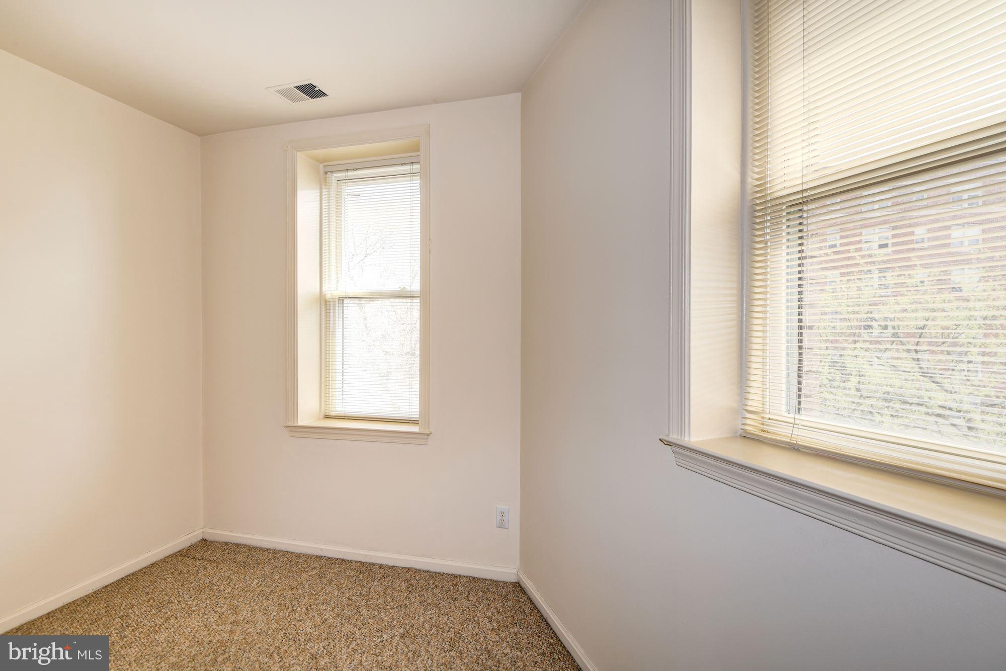 2001 16th Street Northwest, Unit 404 Washington, DC 20009 - Photo 22 of 35 Bedroom with two windows and freshly painted