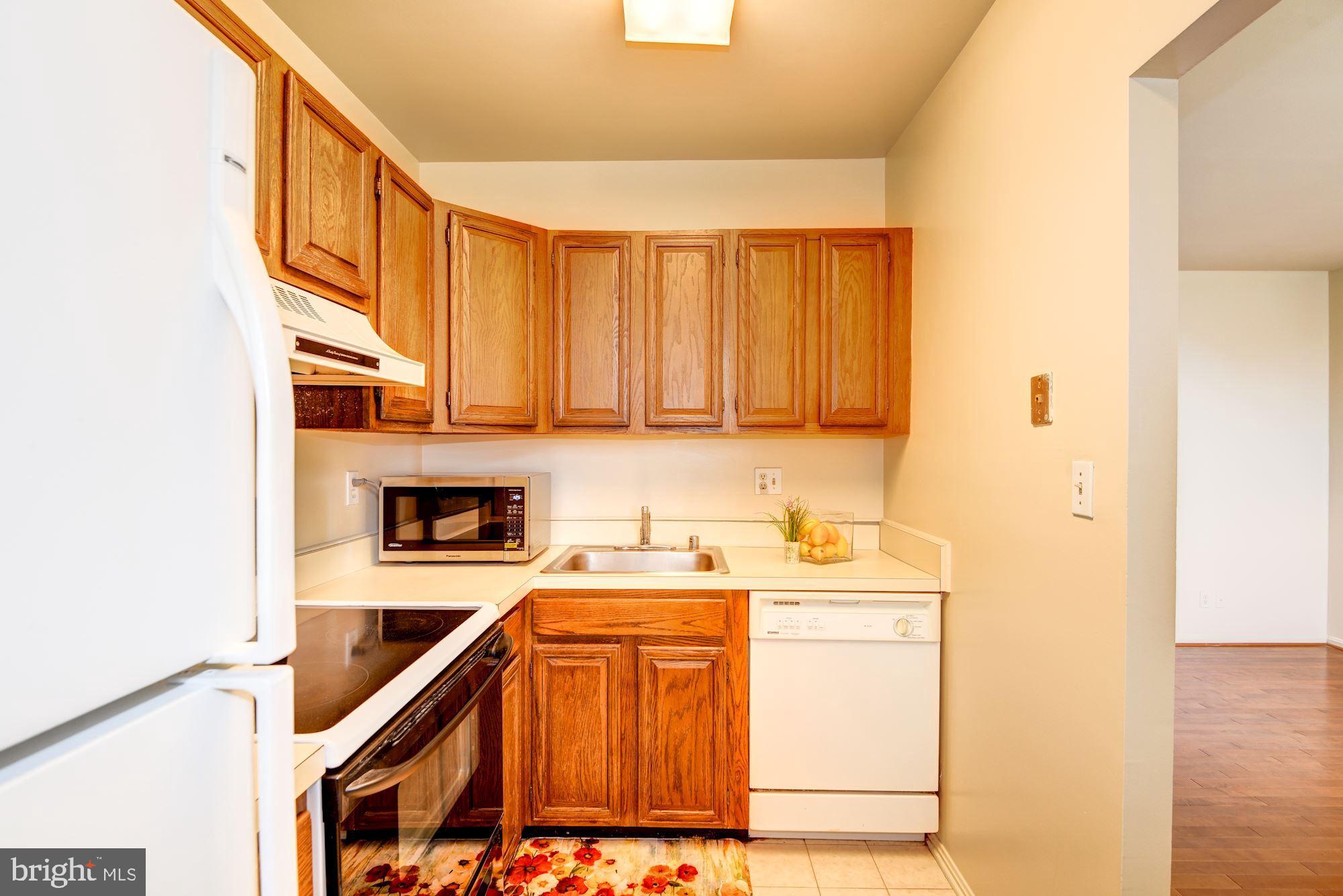 2001 16th Street Northwest, Unit 404 Washington, DC 20009 - Photo 9 of 35 Sparkling kitchen with ceramic floor