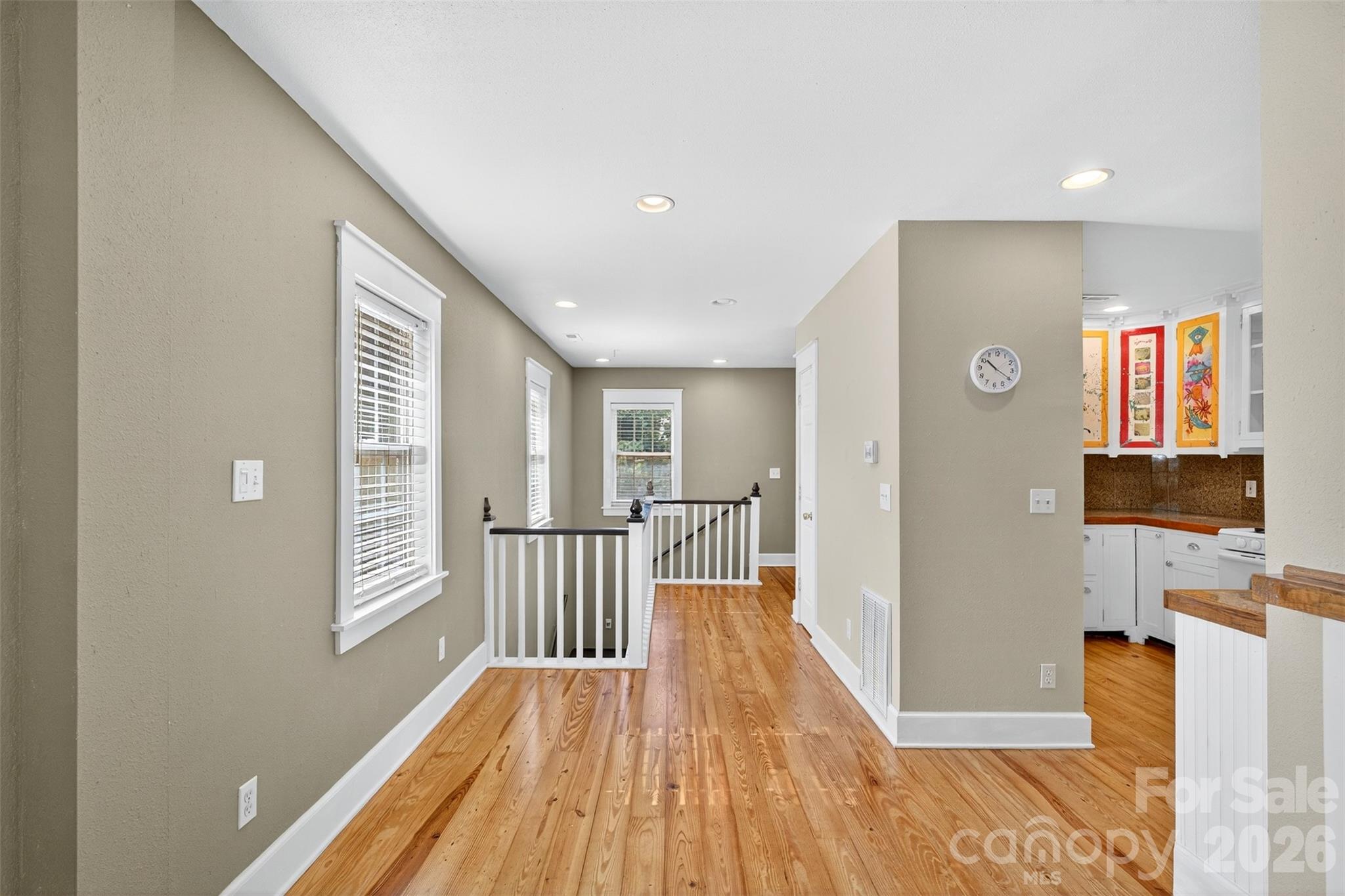 160 East Howard Street Tryon, NC 28782 - Photo 12 of 48 a view of a hallway with wooden floor and staircase