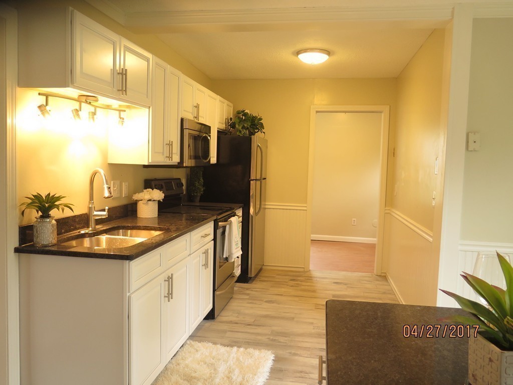 16 Mashapaug Road Sturbridge, MA 01566 - Photo 17 of 26 a bathroom with a sink and a mirror