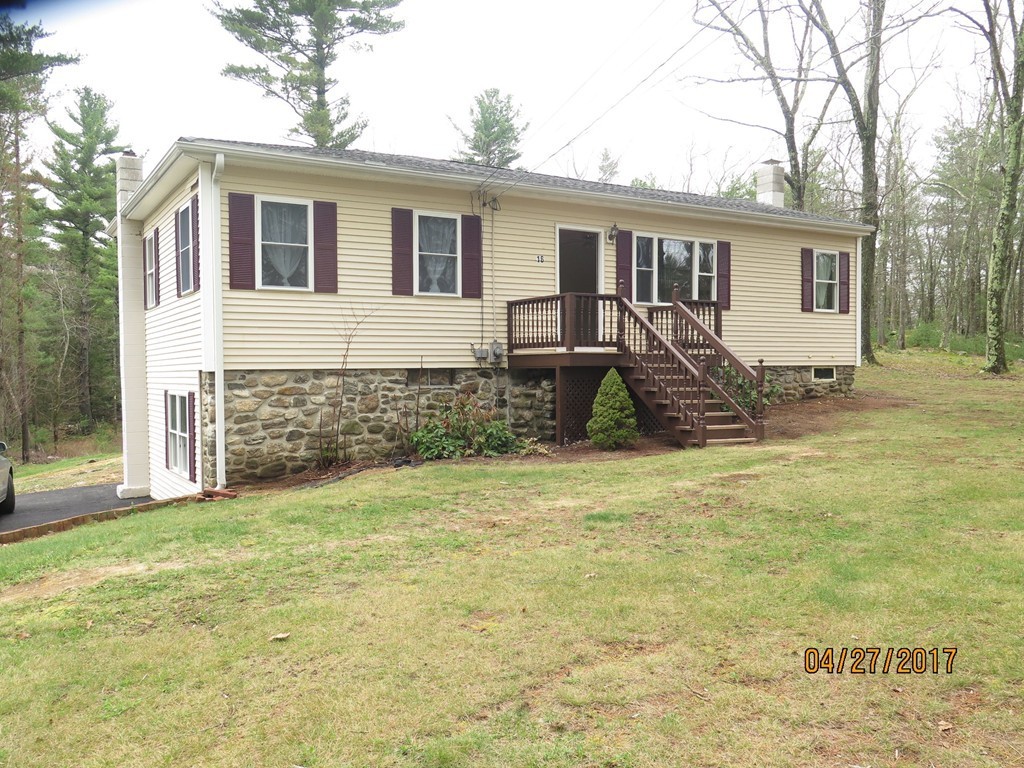 16 Mashapaug Road Sturbridge, MA 01566 - Photo 2 of 26 a view of a house with backyard and sitting area