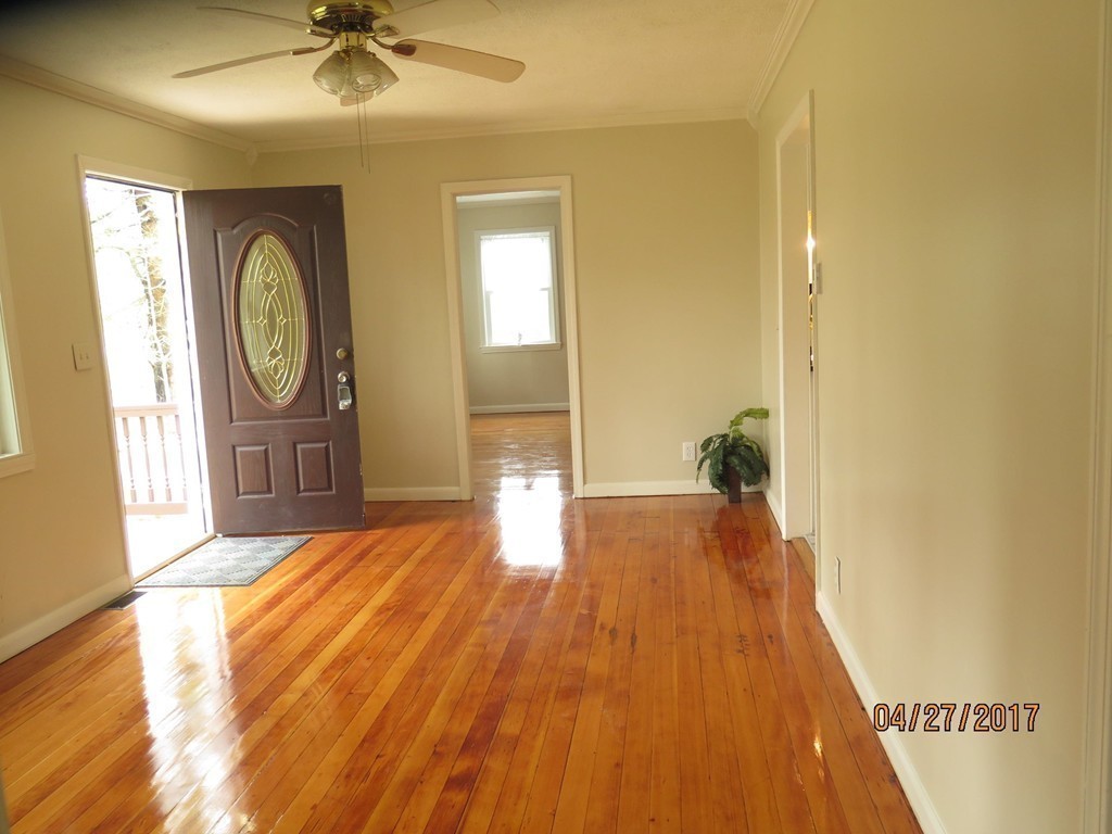 16 Mashapaug Road Sturbridge, MA 01566 - Photo 5 of 26 a view of empty room with wooden floor