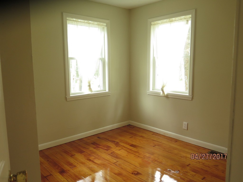 16 Mashapaug Road Sturbridge, MA 01566 - Photo 7 of 26 an empty room with a window