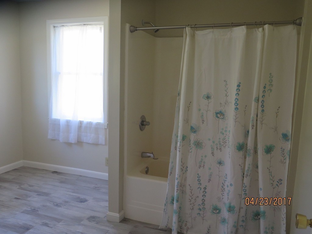16 Mashapaug Road Sturbridge, MA 01566 - Photo 9 of 26 a bathroom with a shower and a tub