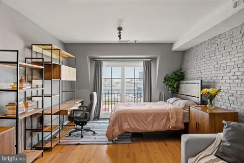 a bedroom with bed and window
