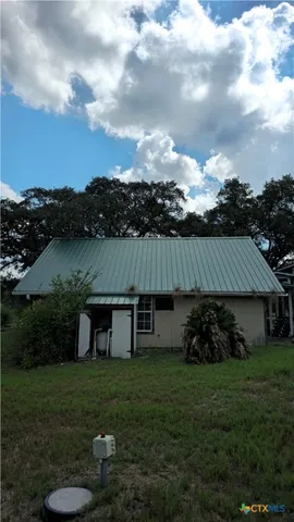 a view of a garden with an outdoor seating