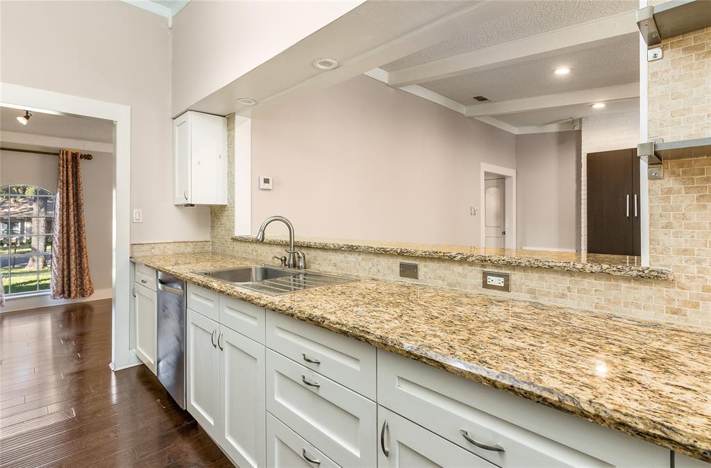 203 Walnut Way Euless, TX 76039 - Photo 16 of 36 a bathroom with a sink and a large mirror