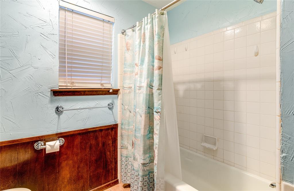 203 Walnut Way Euless, TX 76039 - Photo 22 of 36 a bathroom with a shower and a sink