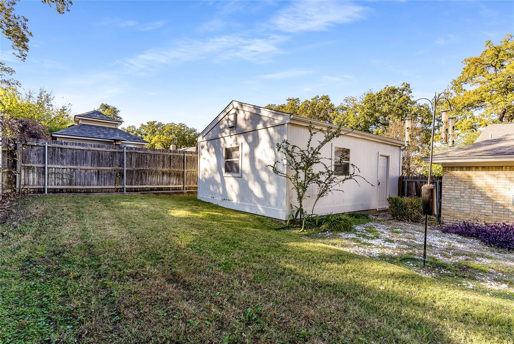 203 Walnut Way Euless, TX 76039 - Photo 33 of 36 a view of a house with a yard