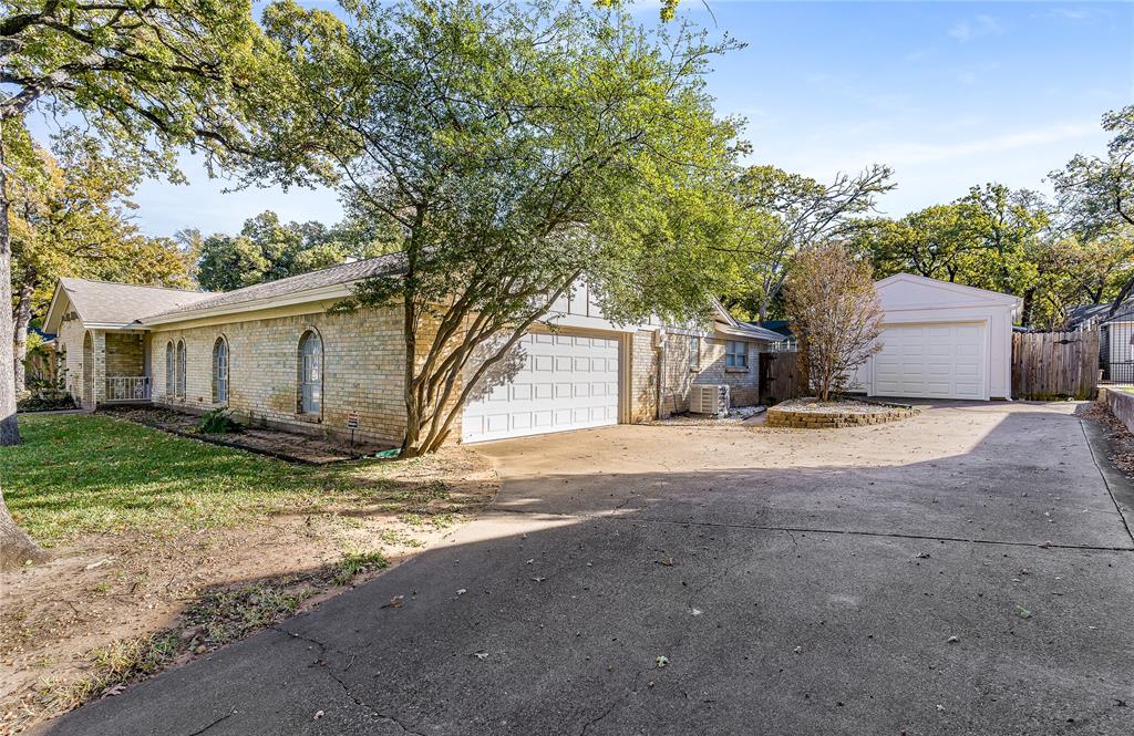 203 Walnut Way Euless, TX 76039 - Photo 36 of 36 a view of a house with a yard and large tree