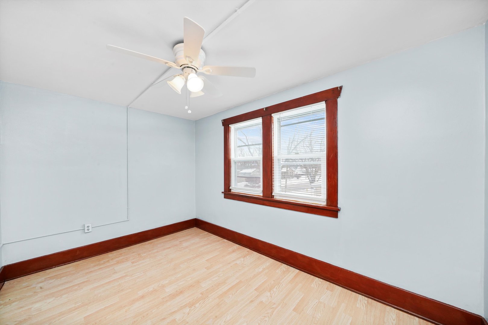 761 North 8th Avenue Kankakee, IL 60901 - Photo 11 of 18 a view of an empty room with wooden floor and a window