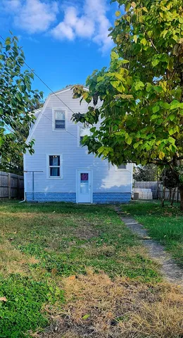a fire hydrant in the middle of a field