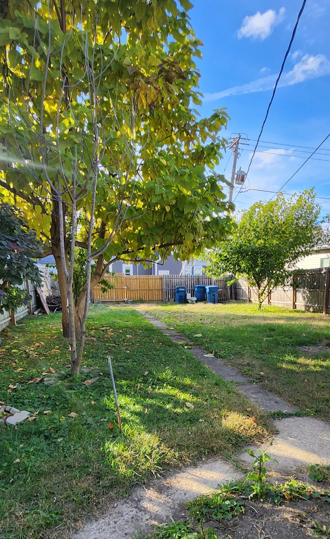 761 North 8th Avenue Kankakee, IL 60901 - Photo 18 of 18 a view of a yard with a tree