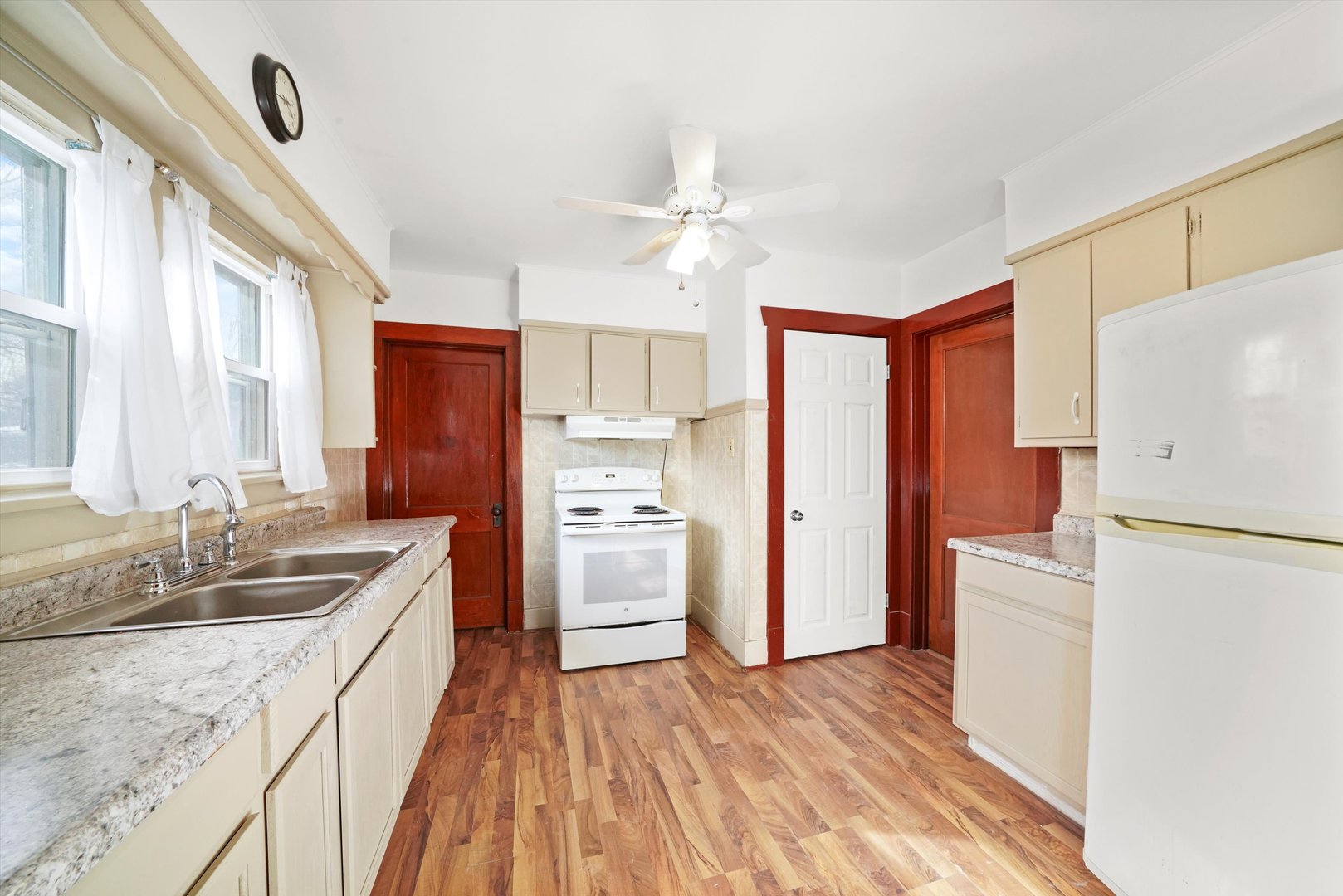 761 North 8th Avenue Kankakee, IL 60901 - Photo 5 of 18 a kitchen with a refrigerator a sink and dishwasher with wooden floor