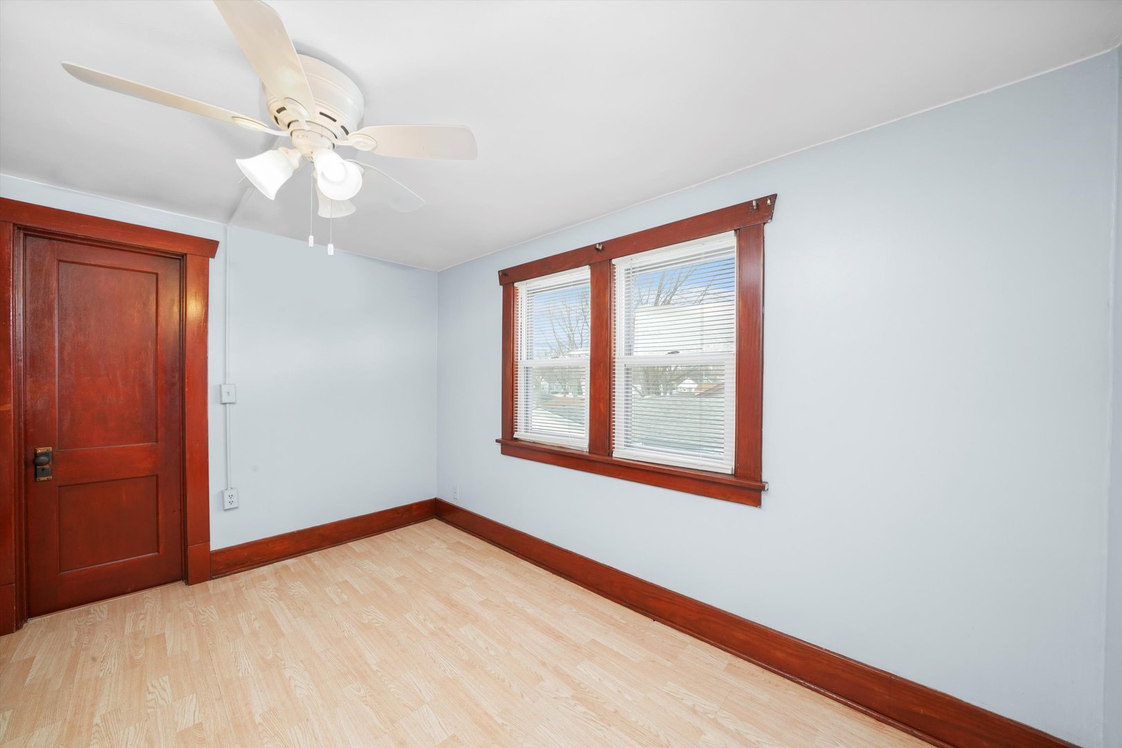 761 North 8th Avenue Kankakee, IL 60901 - Photo 10 of 18 an empty room with windows and fan