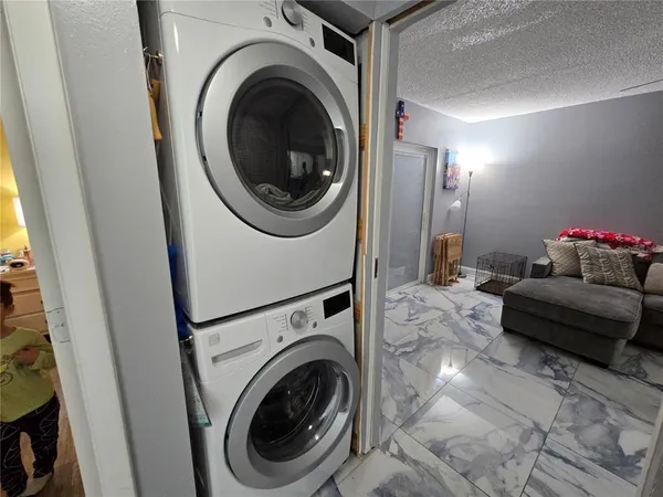 a bathroom with a sink a toilet and shower curtain