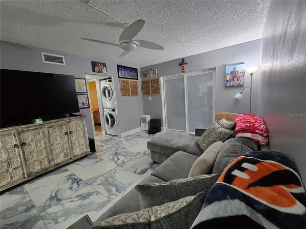 a bedroom with a bed and a television