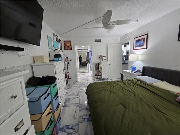 a bathroom with a double vanity sink toilet and shower