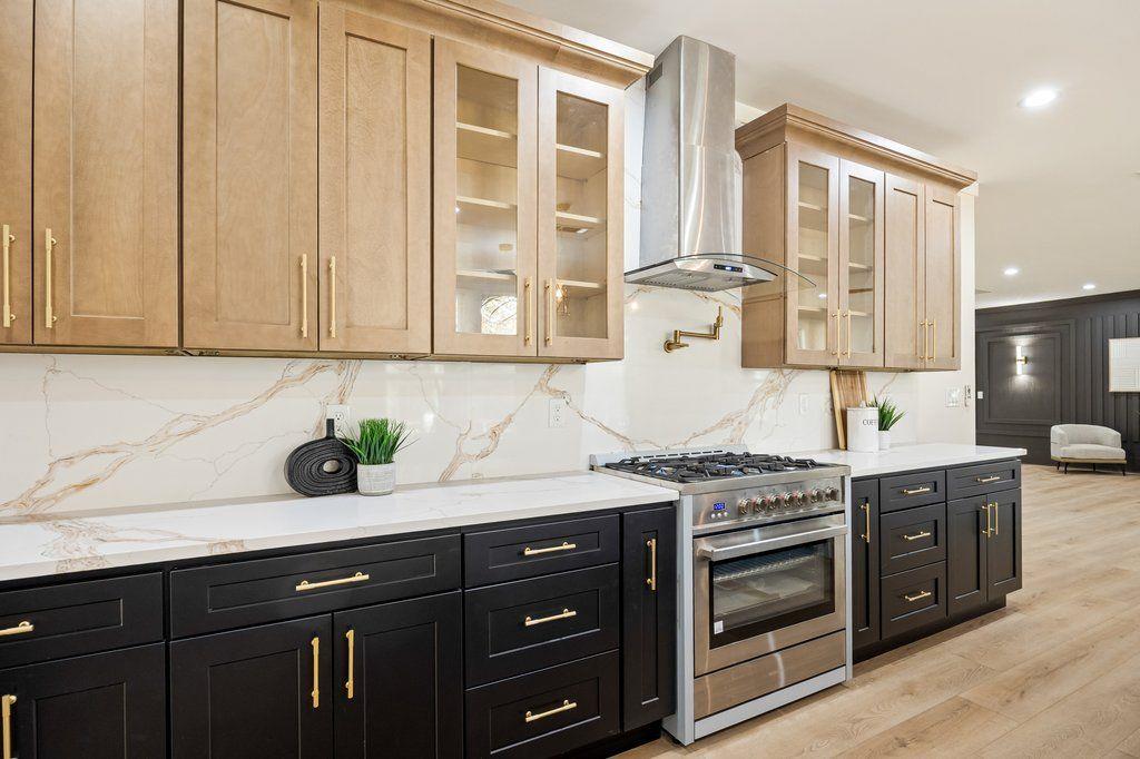 1755 Snapfinger Road Decatur, GA 30032 - Photo 12 of 52 a kitchen with stainless steel appliances granite countertop a stove and a sink