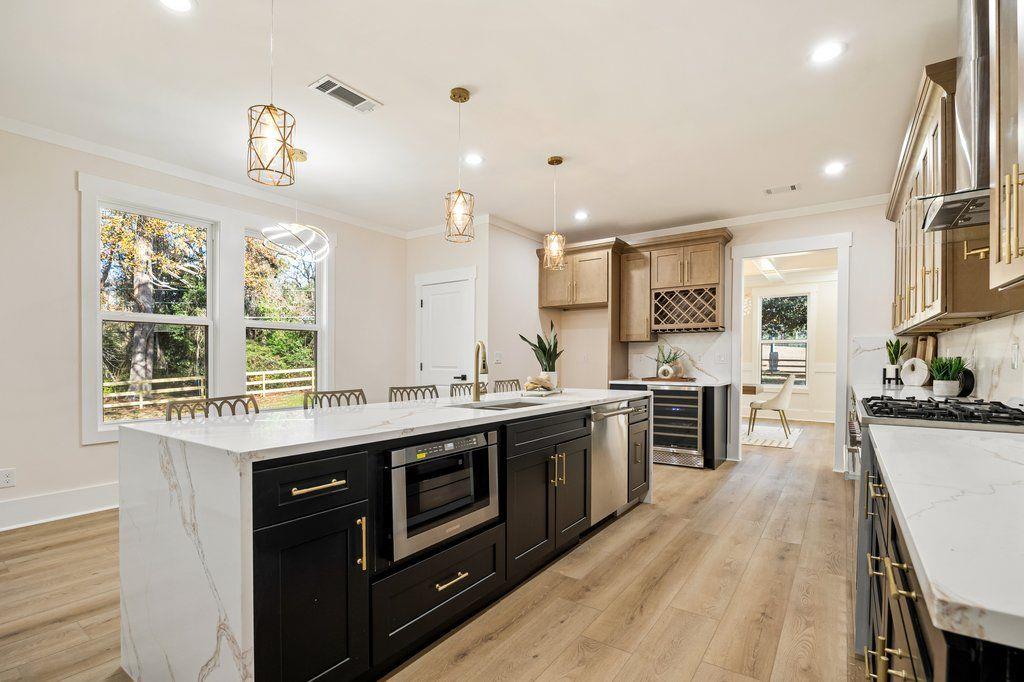 1755 Snapfinger Road Decatur, GA 30032 - Photo 15 of 52 a kitchen with a sink stove top oven and refrigerator