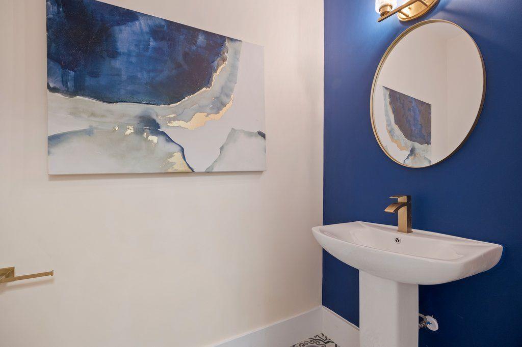 1755 Snapfinger Road Decatur, GA 30032 - Photo 17 of 52 a bathroom with a sink and mirror