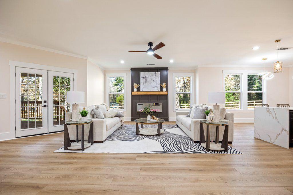 1755 Snapfinger Road Decatur, GA 30032 - Photo 19 of 52 a living room with fireplace furniture and a wooden floor