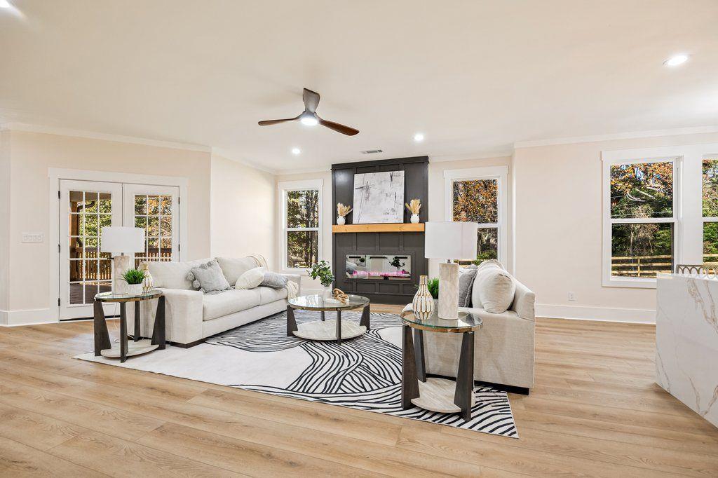 1755 Snapfinger Road Decatur, GA 30032 - Photo 20 of 52 a living room with furniture a fireplace and a window