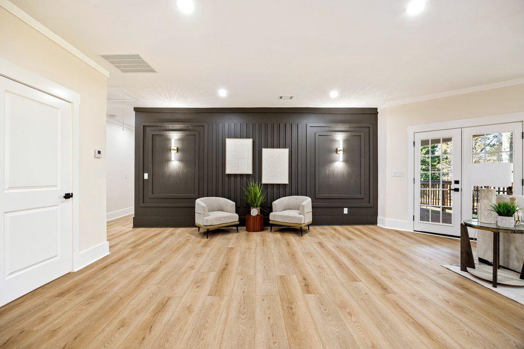 1755 Snapfinger Road Decatur, GA 30032 - Photo 21 of 52 a spacious bedroom with a bed and wooden floor