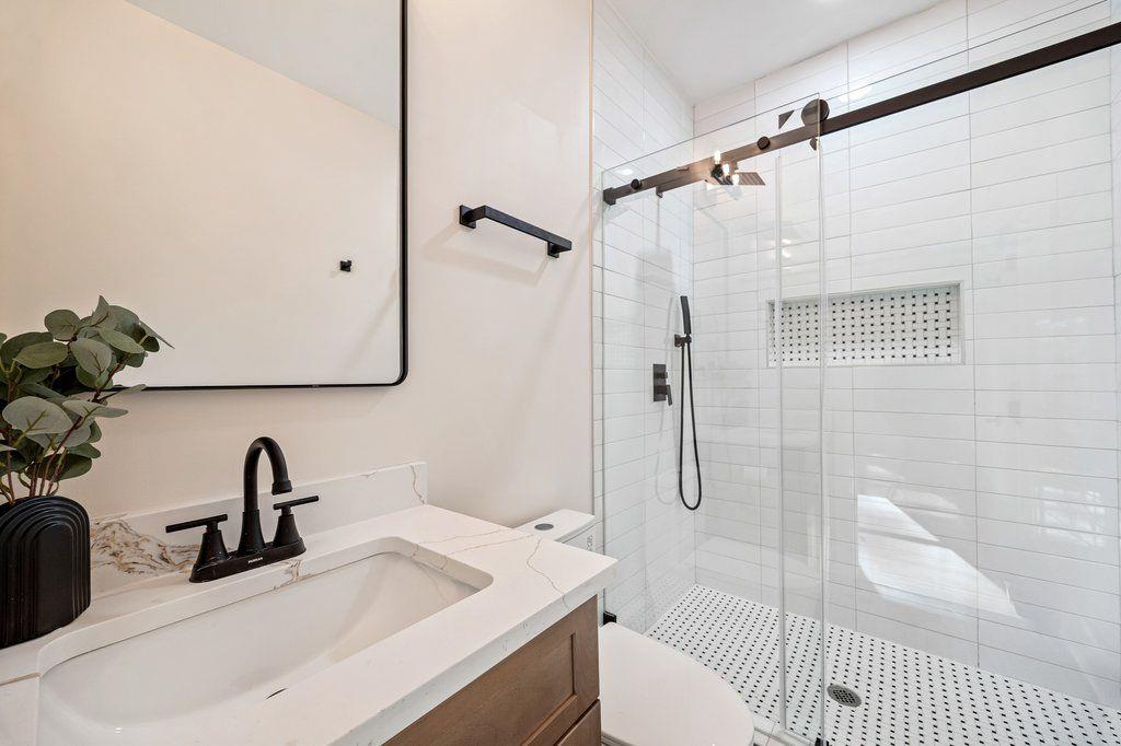 1755 Snapfinger Road Decatur, GA 30032 - Photo 24 of 52 a bathroom with a sink toilet and shower