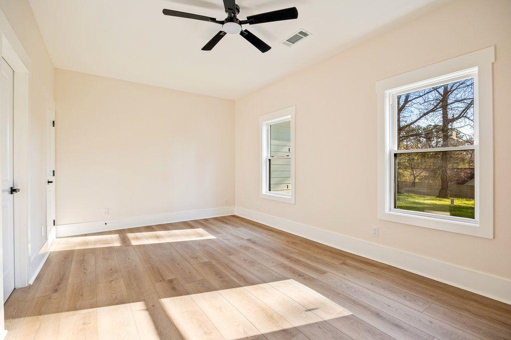 1755 Snapfinger Road Decatur, GA 30032 - Photo 25 of 52 wooden floor in an empty room with a window