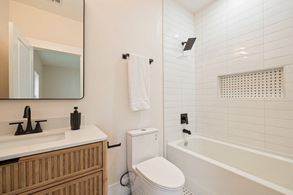 1755 Snapfinger Road Decatur, GA 30032 - Photo 30 of 52 a bathroom with a sink a toilet and shower