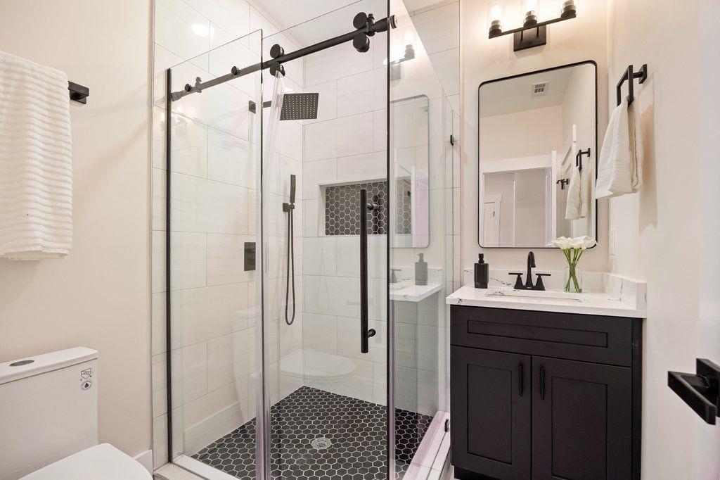 1755 Snapfinger Road Decatur, GA 30032 - Photo 41 of 52 a bathroom with a sink a toilet and shower