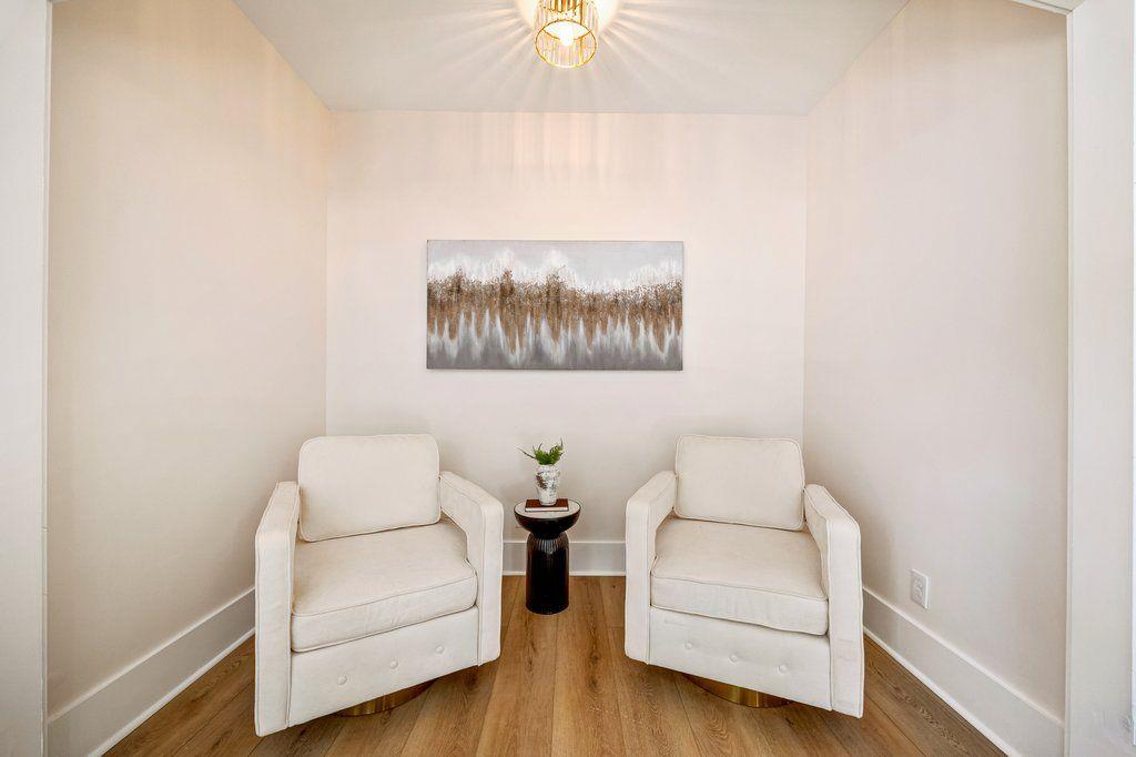 1755 Snapfinger Road Decatur, GA 30032 - Photo 7 of 52 a living room with furniture and a wall painting