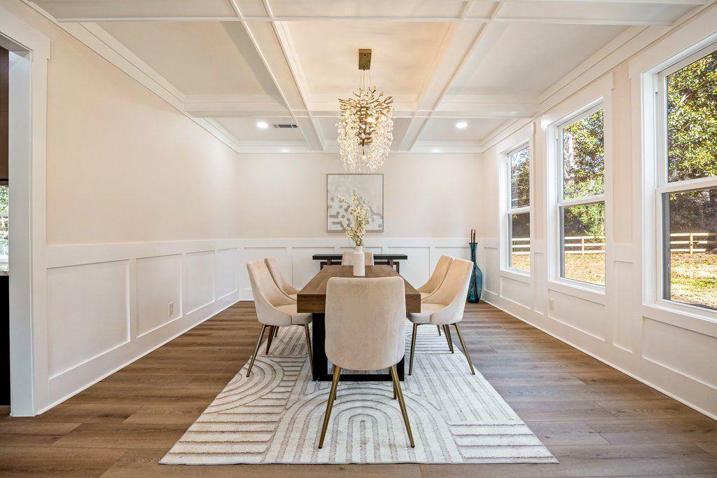 1755 Snapfinger Road Decatur, GA 30032 - Photo 8 of 52 a view of a dining room with furniture wooden floor and chandelier