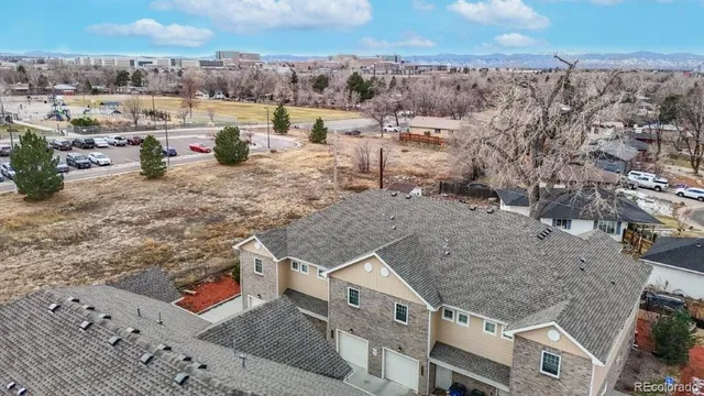 an aerial view of a house with a yard water fountain and barbeque oven