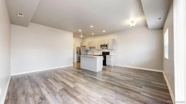 a view of kitchen with wooden floor
