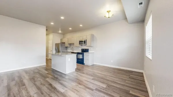 a view of kitchen with wooden floor