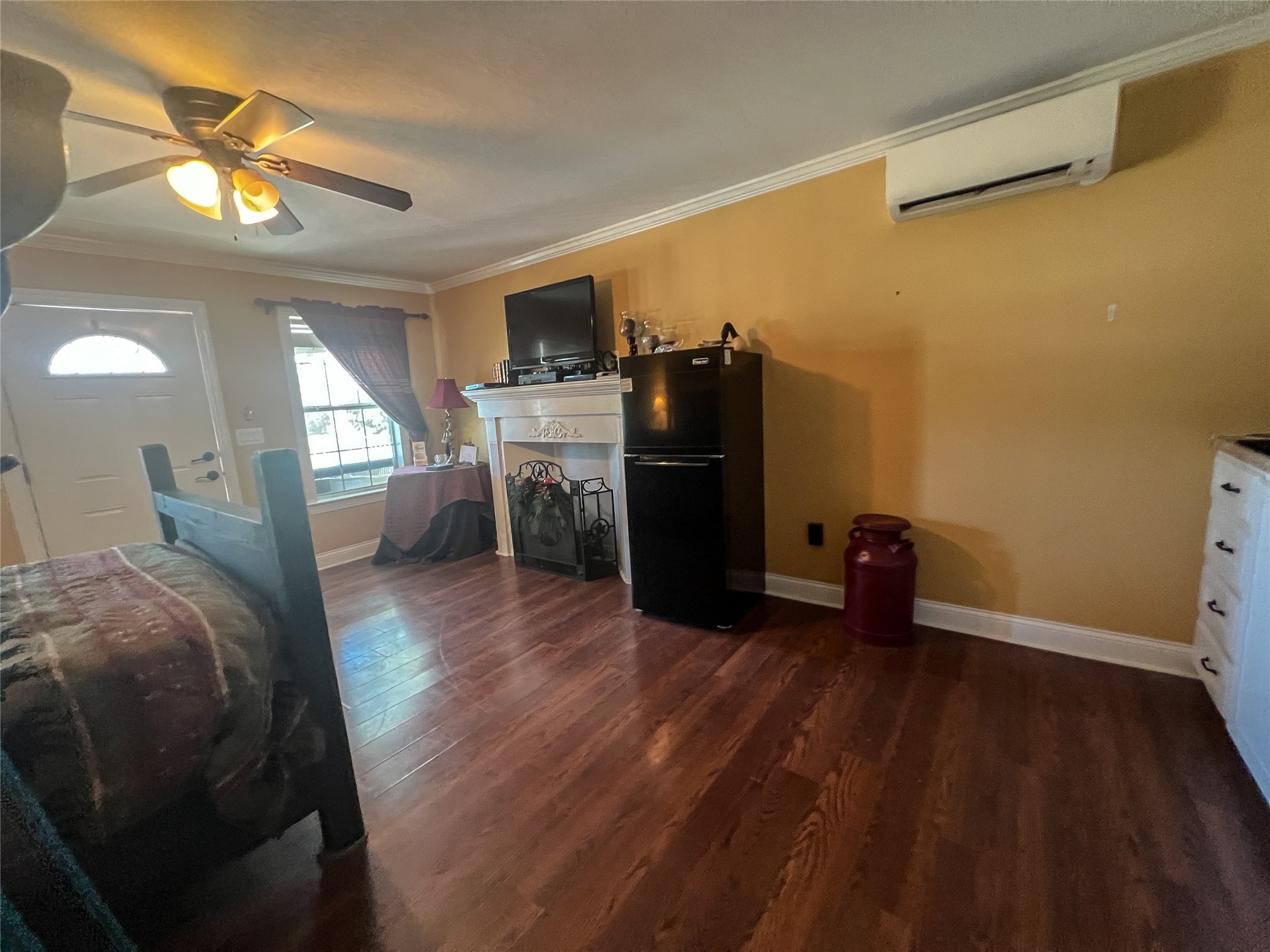 9500 Mayfield Avenue, Unit C Shiro, TX 77873 - Photo 9 of 12 a view of a livingroom with furniture and wooden floor