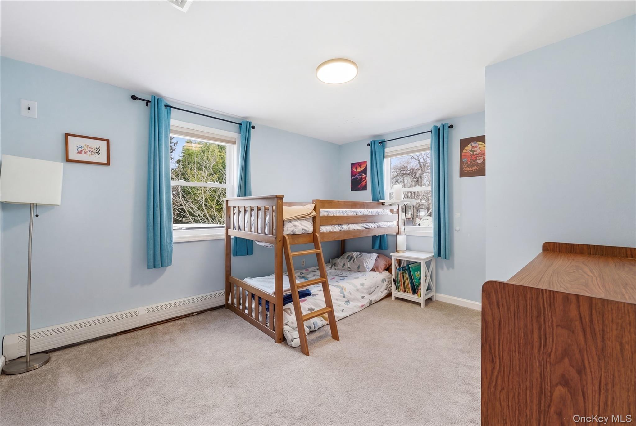 214 Ralph Avenue Babylon, NY 11702 - Photo 14 of 33 a room with furniture and a window