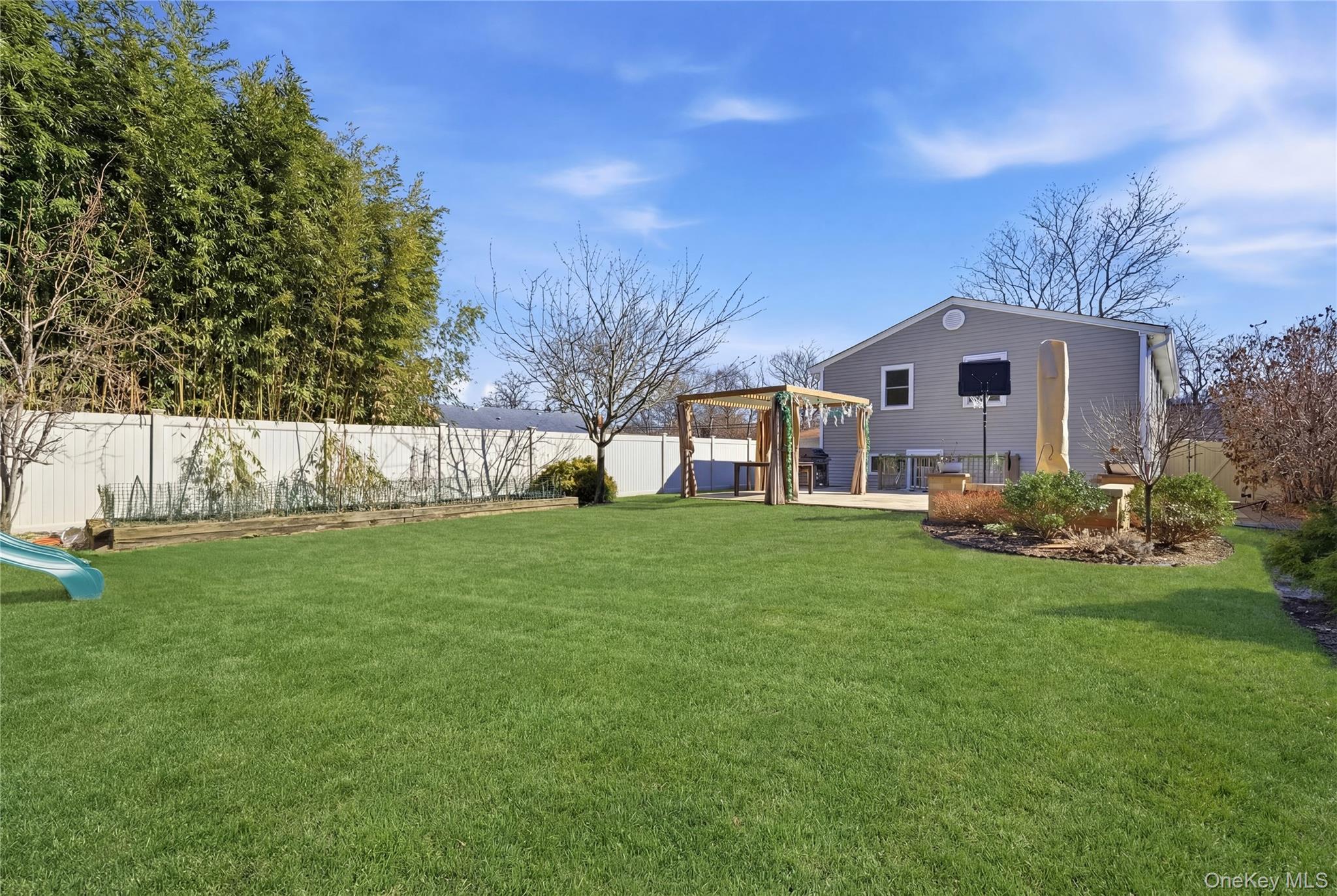214 Ralph Avenue Babylon, NY 11702 - Photo 27 of 33 a front view of a house with garden