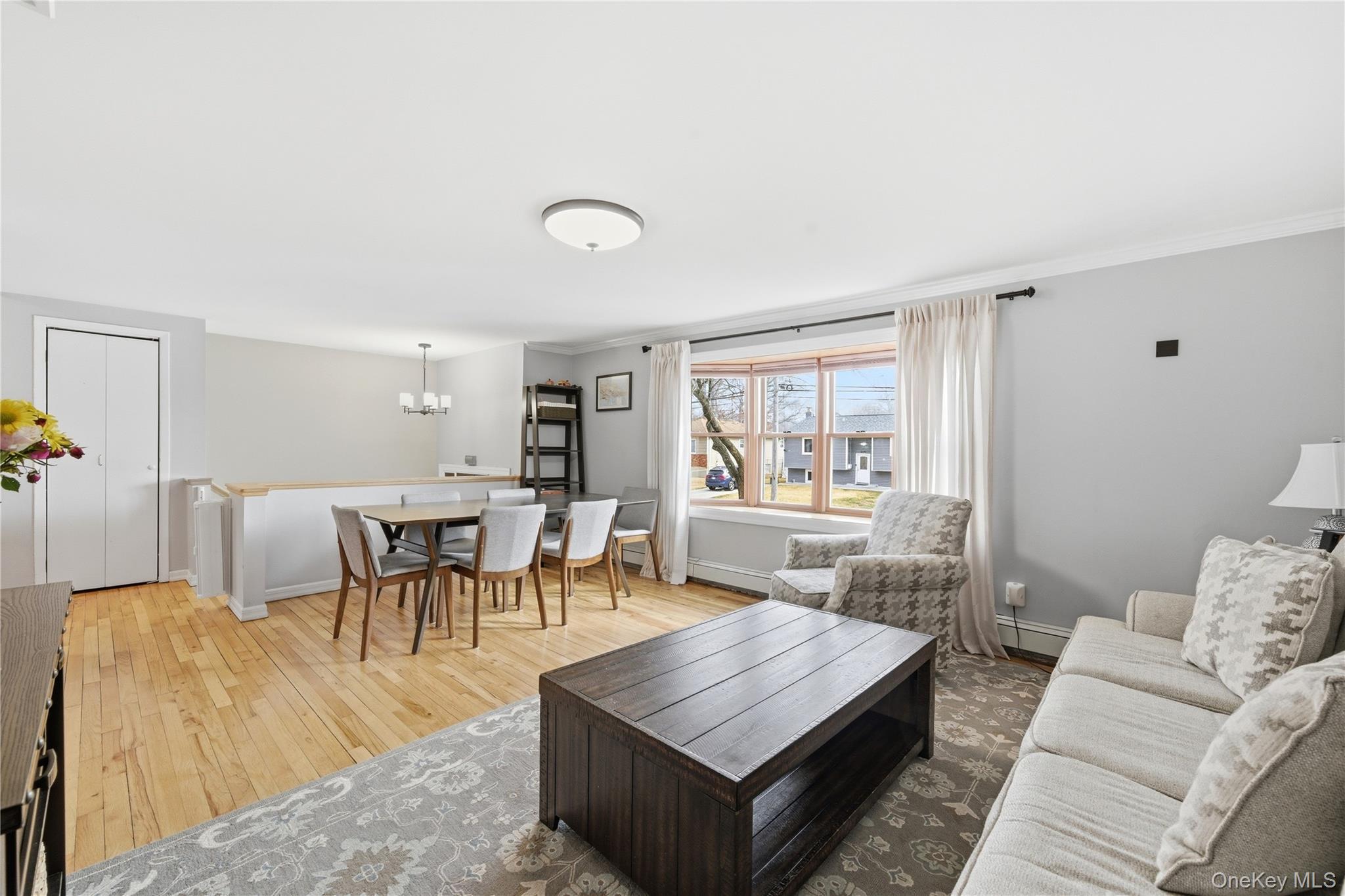 214 Ralph Avenue Babylon, NY 11702 - Photo 6 of 33 a living room with furniture and a table