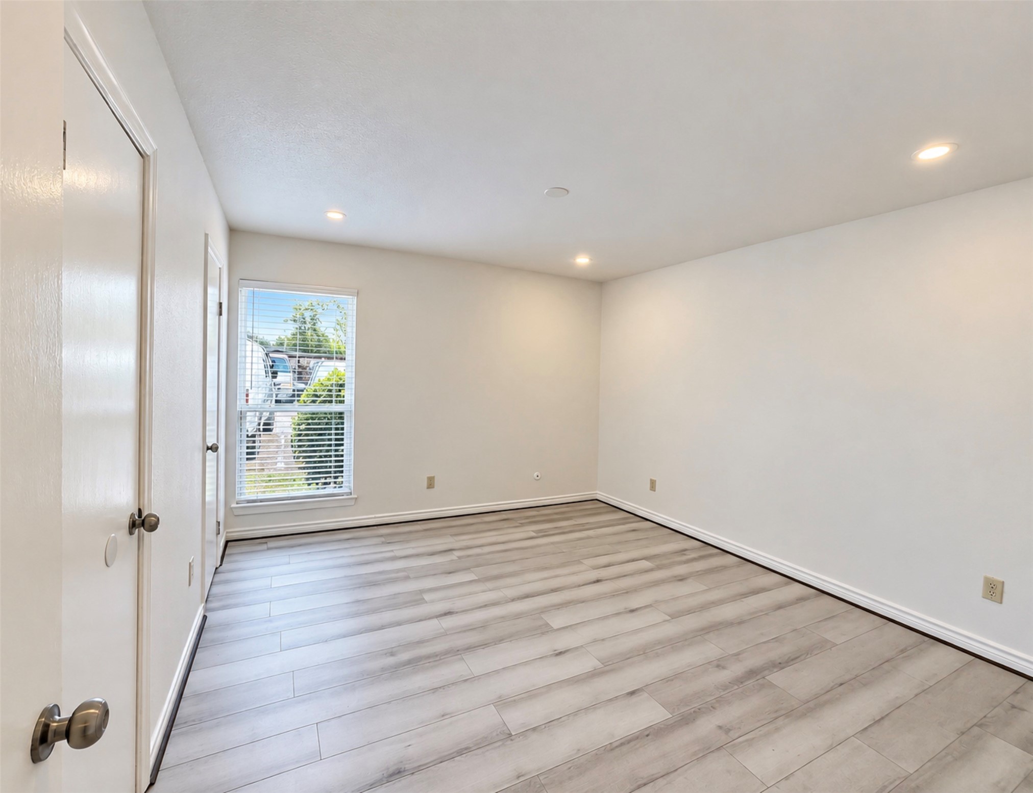9616 Long Point Road, Unit 63 Houston, TX 77055 - Photo 6 of 18 Primary bedroom with two closets, lots of recess lighting and a window for natural light