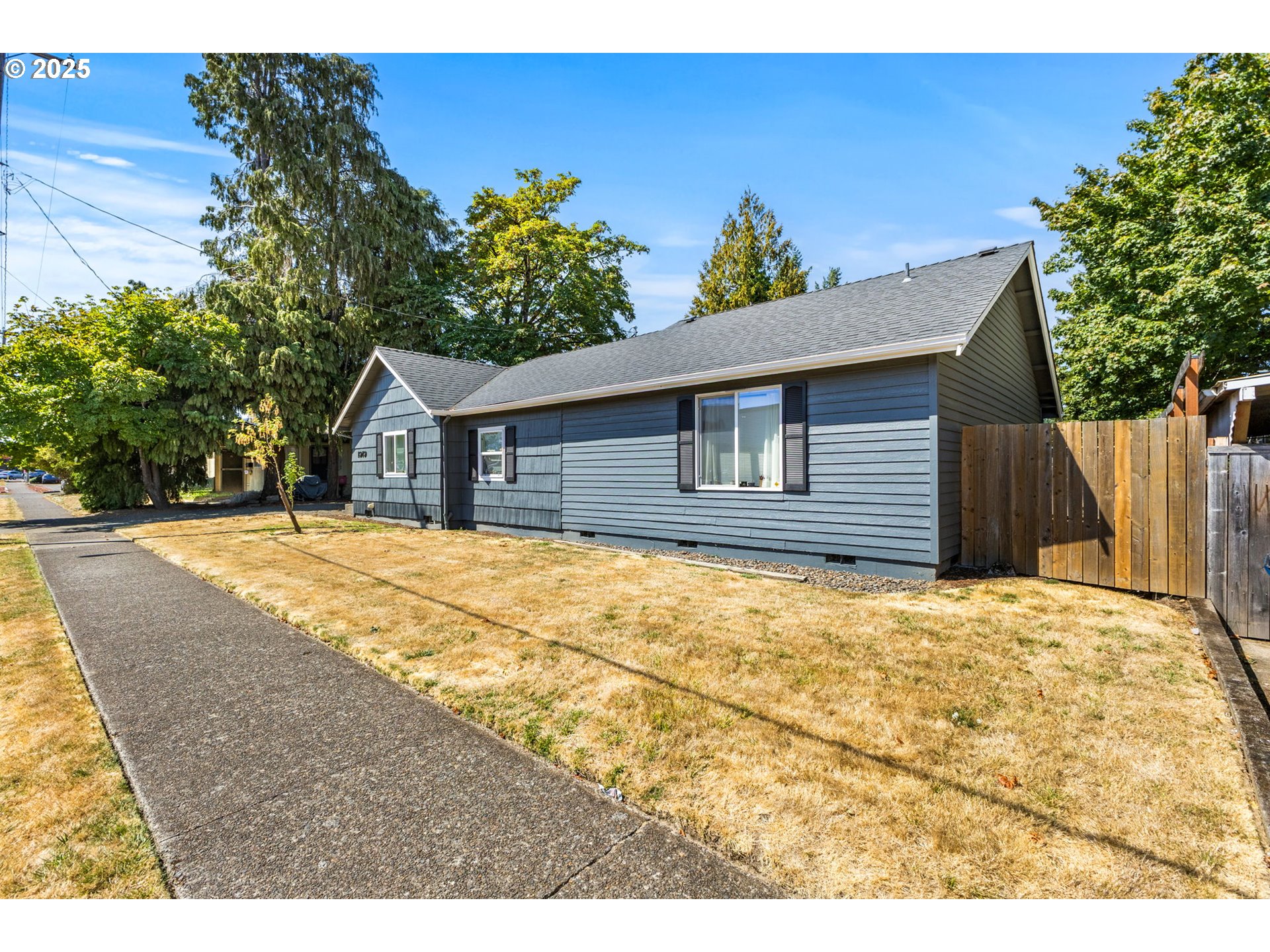 a house with trees in the background