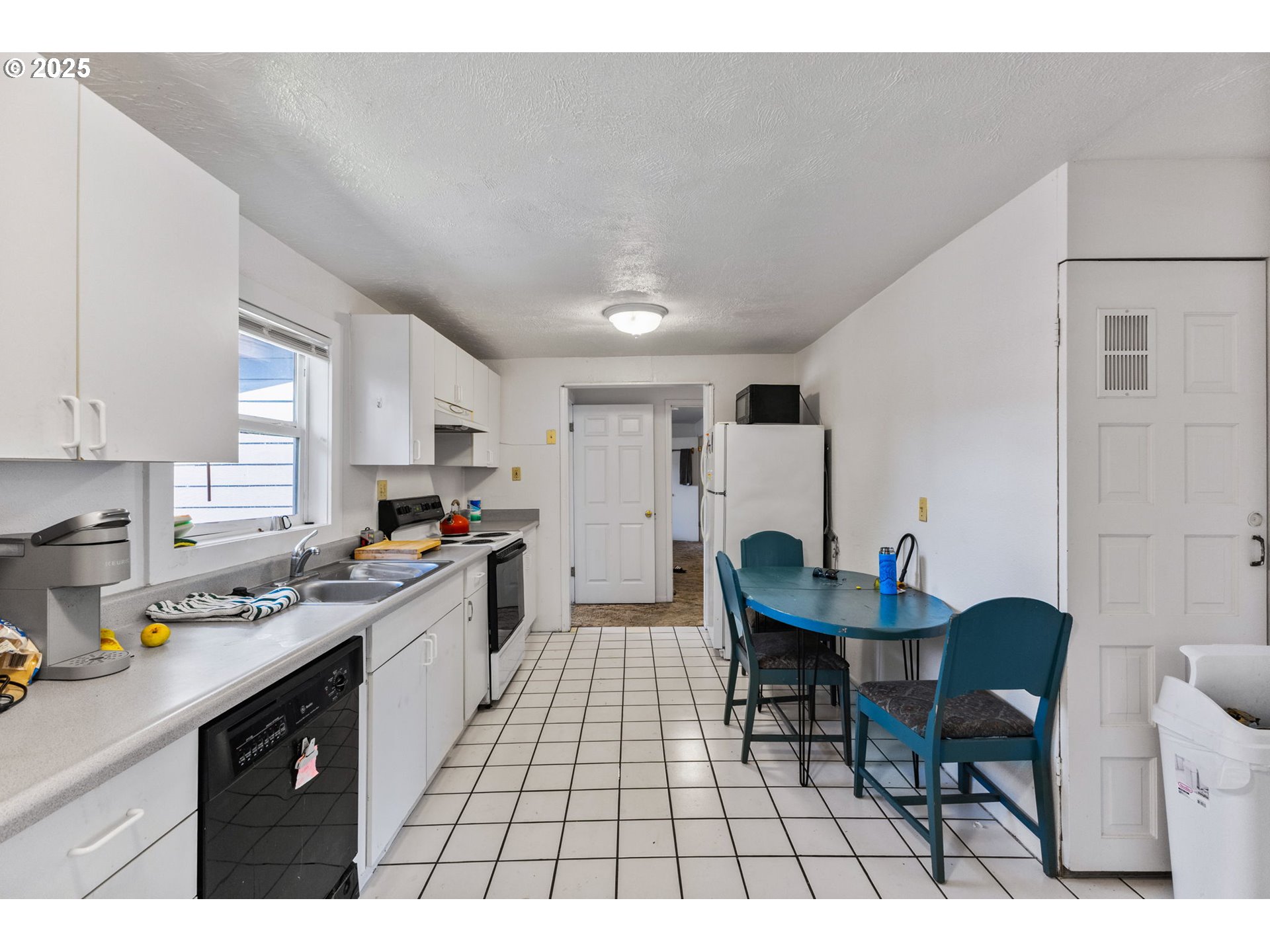 1919 Northwest Buchanan Avenue Corvallis, OR 97330 - Photo 12 of 30 a kitchen with a sink cabinets and window