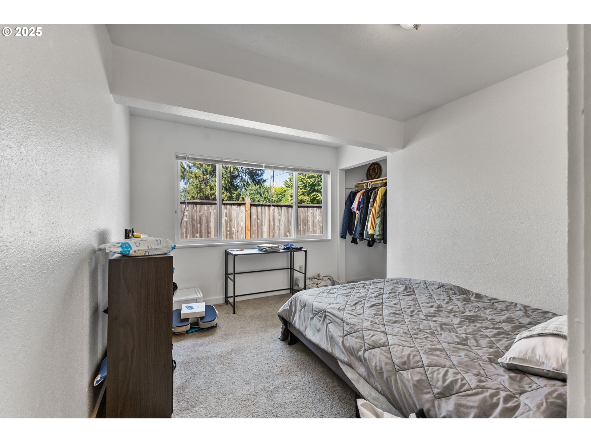 1919 Northwest Buchanan Avenue Corvallis, OR 97330 - Photo 16 of 30 a bedroom with a bed and a window