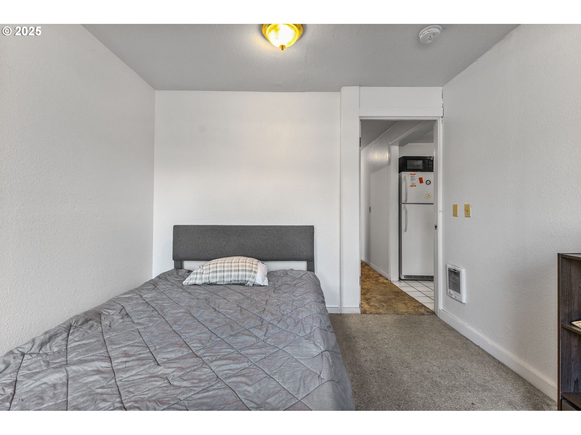 1919 Northwest Buchanan Avenue Corvallis, OR 97330 - Photo 17 of 30 a bedroom with a bed and painting on the wall