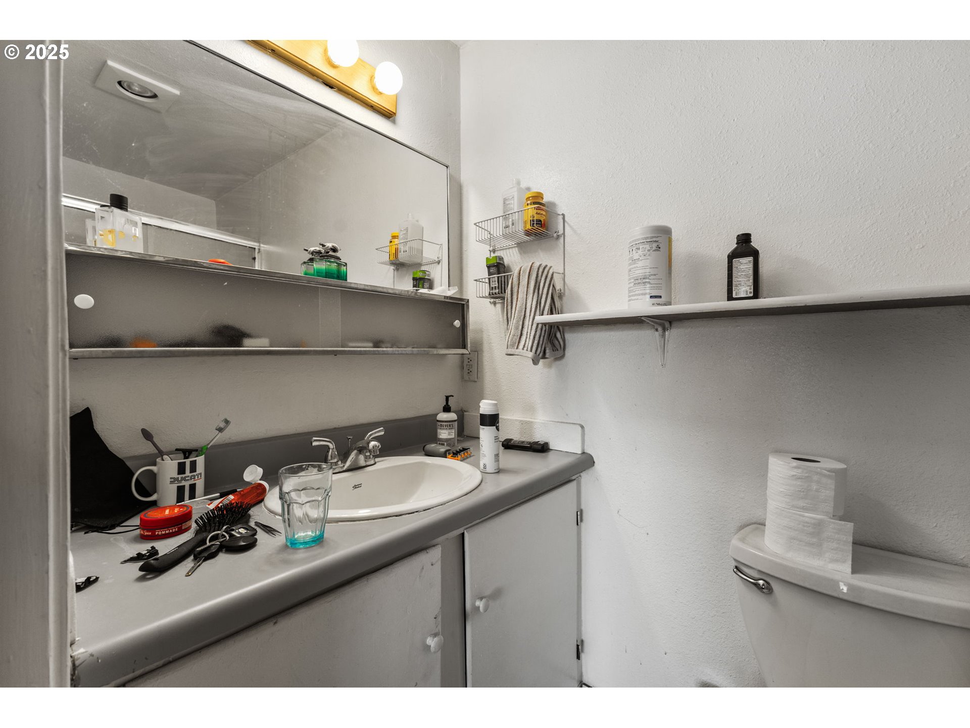 1919 Northwest Buchanan Avenue Corvallis, OR 97330 - Photo 20 of 30 a bathroom with a sink and a mirror